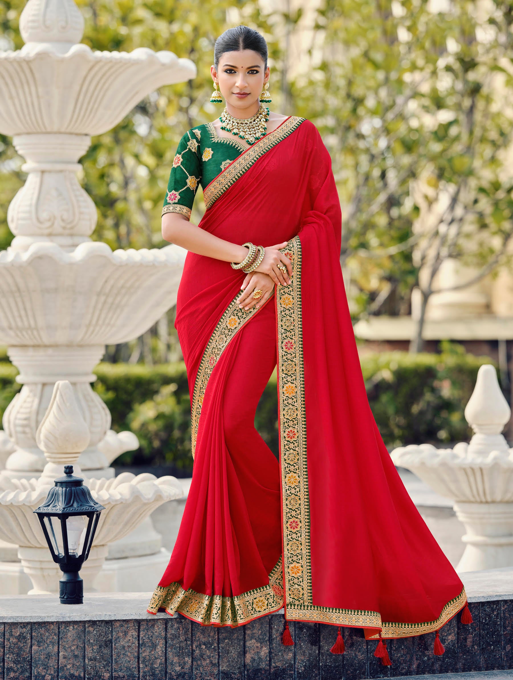 Red Silk Saree with Intricate Embroidered Border and Green Designer Blouse