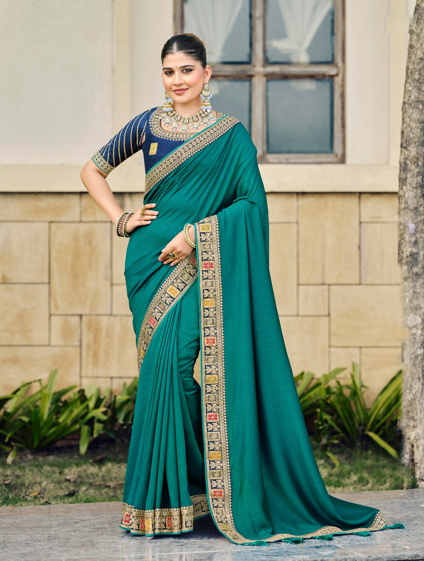 Teal Green Silk Saree with Antique Gold Embroidered Border and Navy Blue Blouse