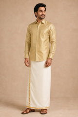 Rajavivaha gold silk shirt for men, worn with a cream gold-bordered veshti, full length front view on model